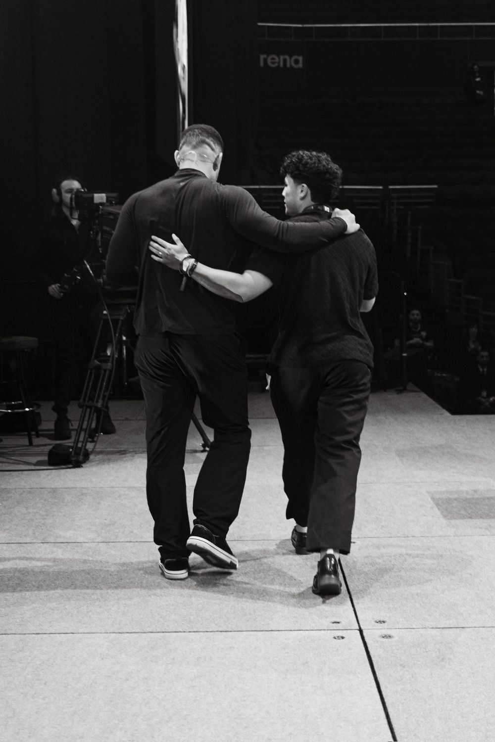 Lumore and Steven Bartlett walking off stage arm in arm
